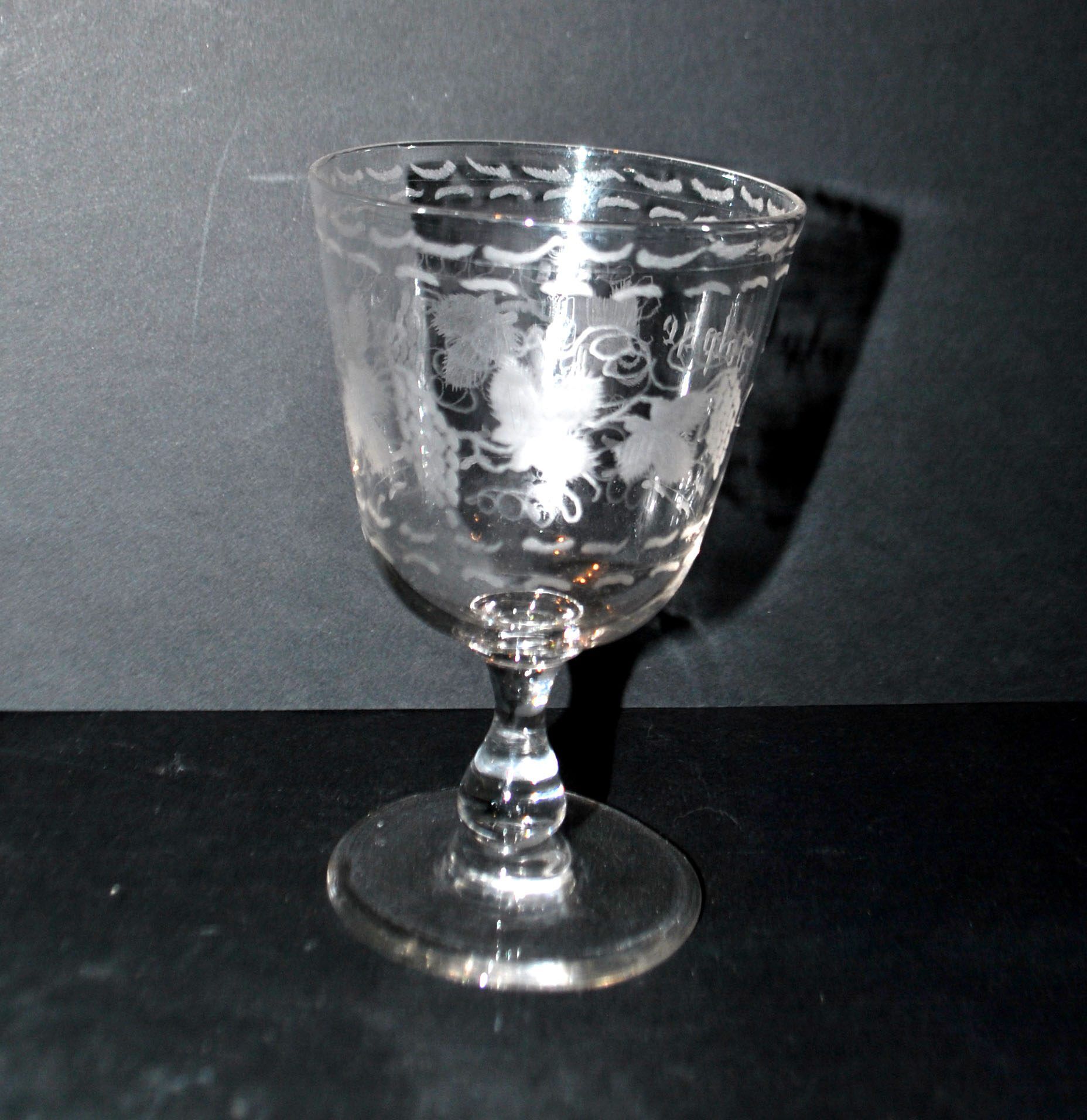 Antique souvenir glass tumbler engraved with the name Adolphe