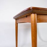 Dining table in teak with extentions and legs in oak, of danish design from the 1960s.