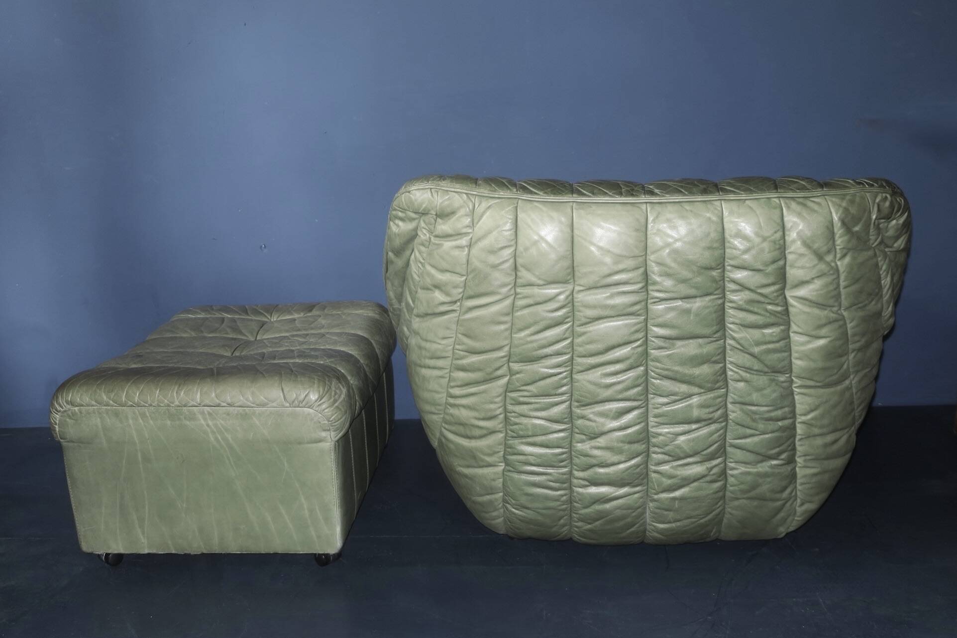 Laauser lounge chair and ottoman in olive green patchwork leather, 1970s