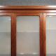Large pine bookcase with three doors, fitted with frosted glass.