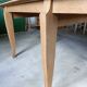 Oak dining table with a checkerboard top and extensions.