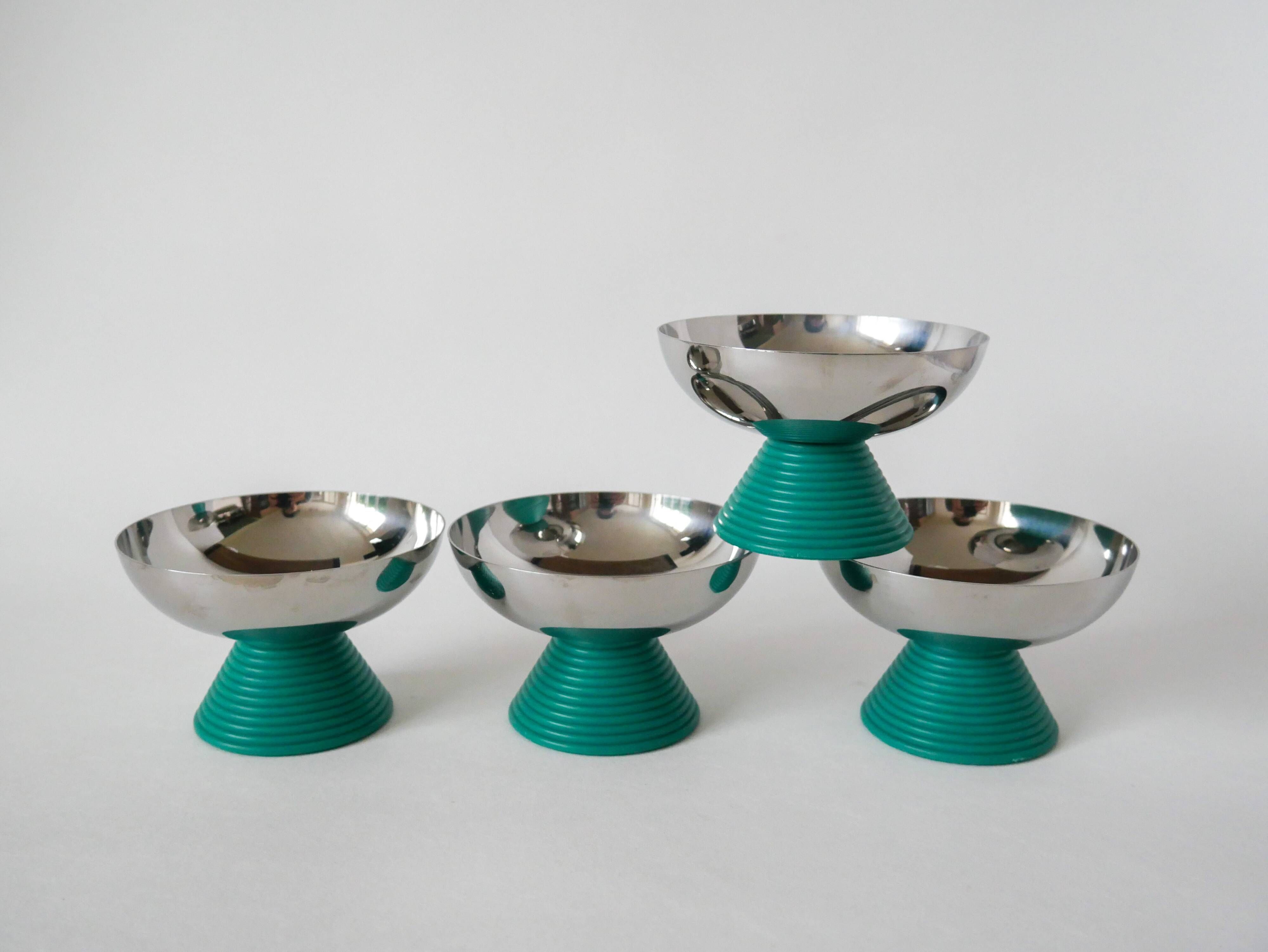 set of 4 large stainless steel bowls and green plastic feet 1970