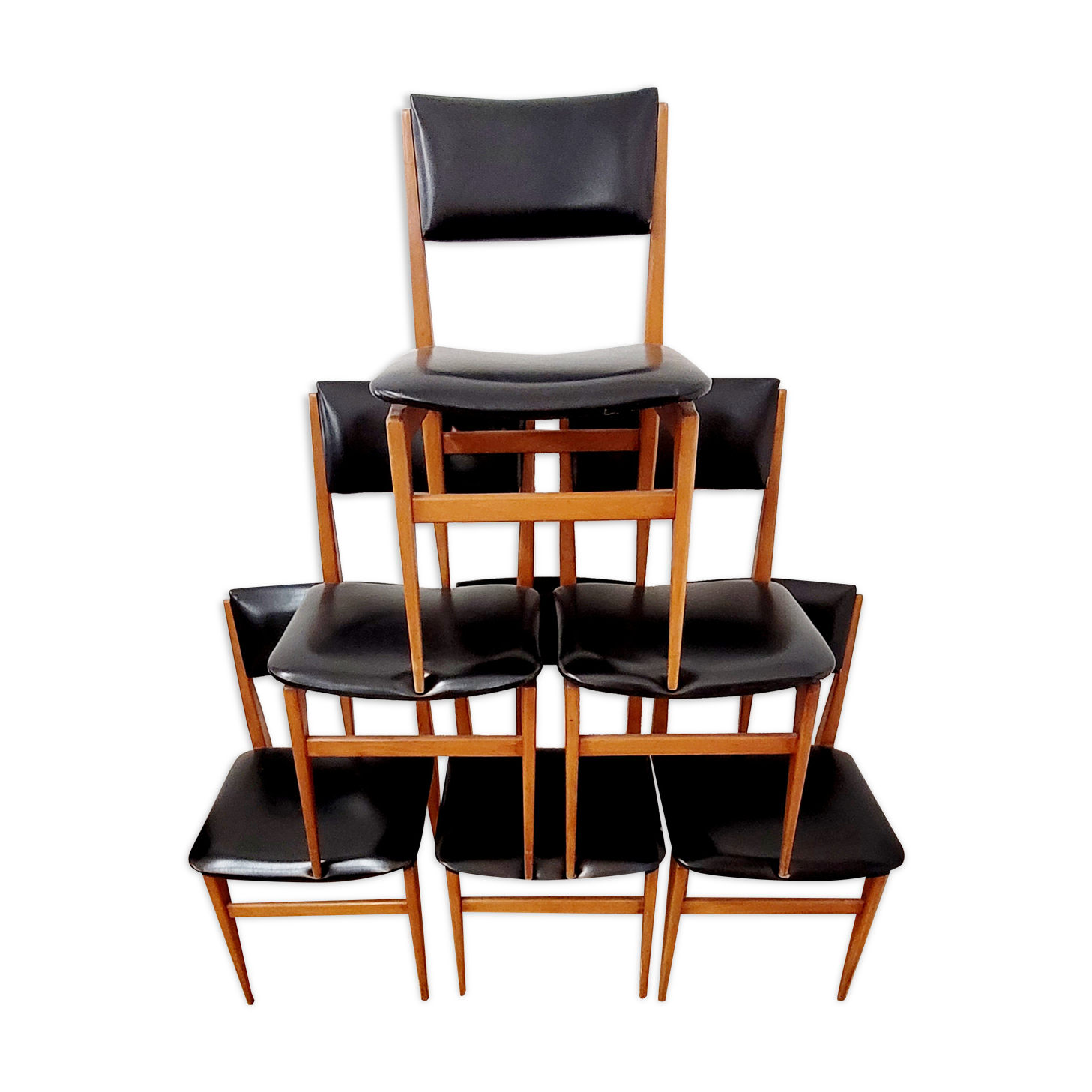 Six vintage wooden chairs and black Skaï