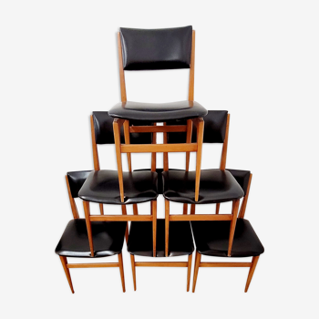 Six vintage wooden chairs and black Skaï