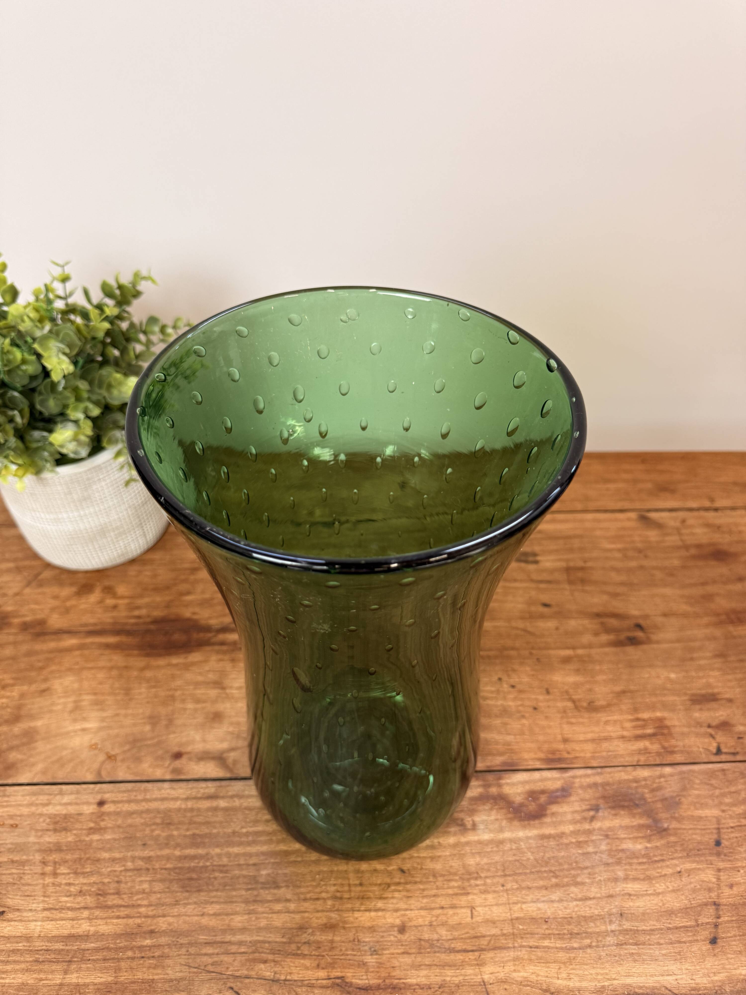 Green blown glass vase with a bubble design