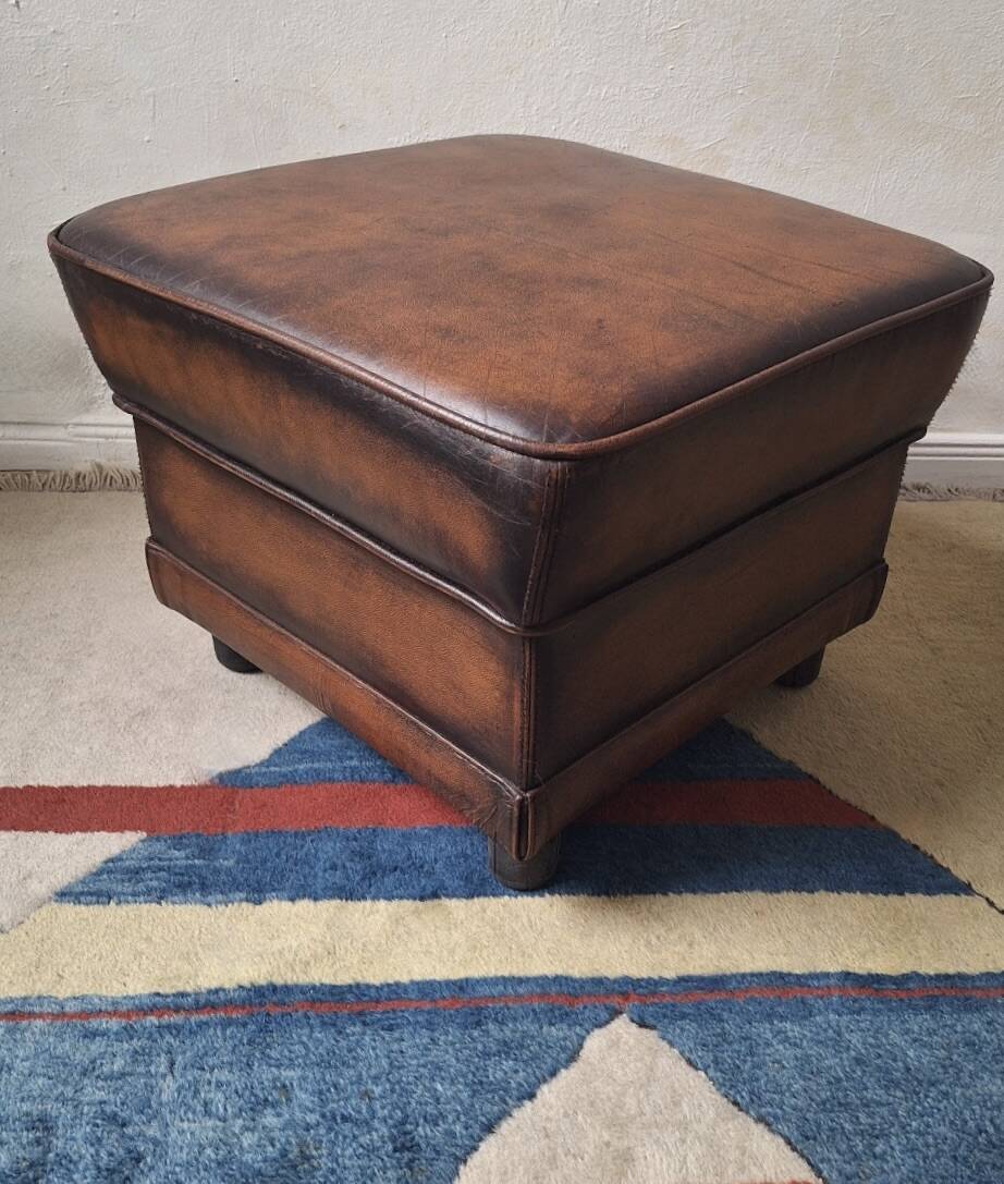 Vintage ottoman / pouffe in chestnut brown leather