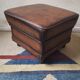 Vintage ottoman / pouffe in chestnut brown leather