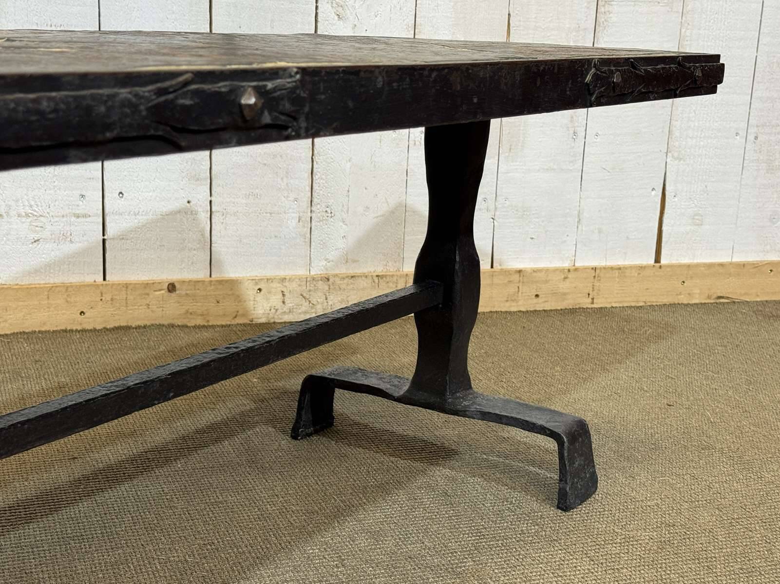 Coffee table in wrought iron with a slate top, work from the 1950s.