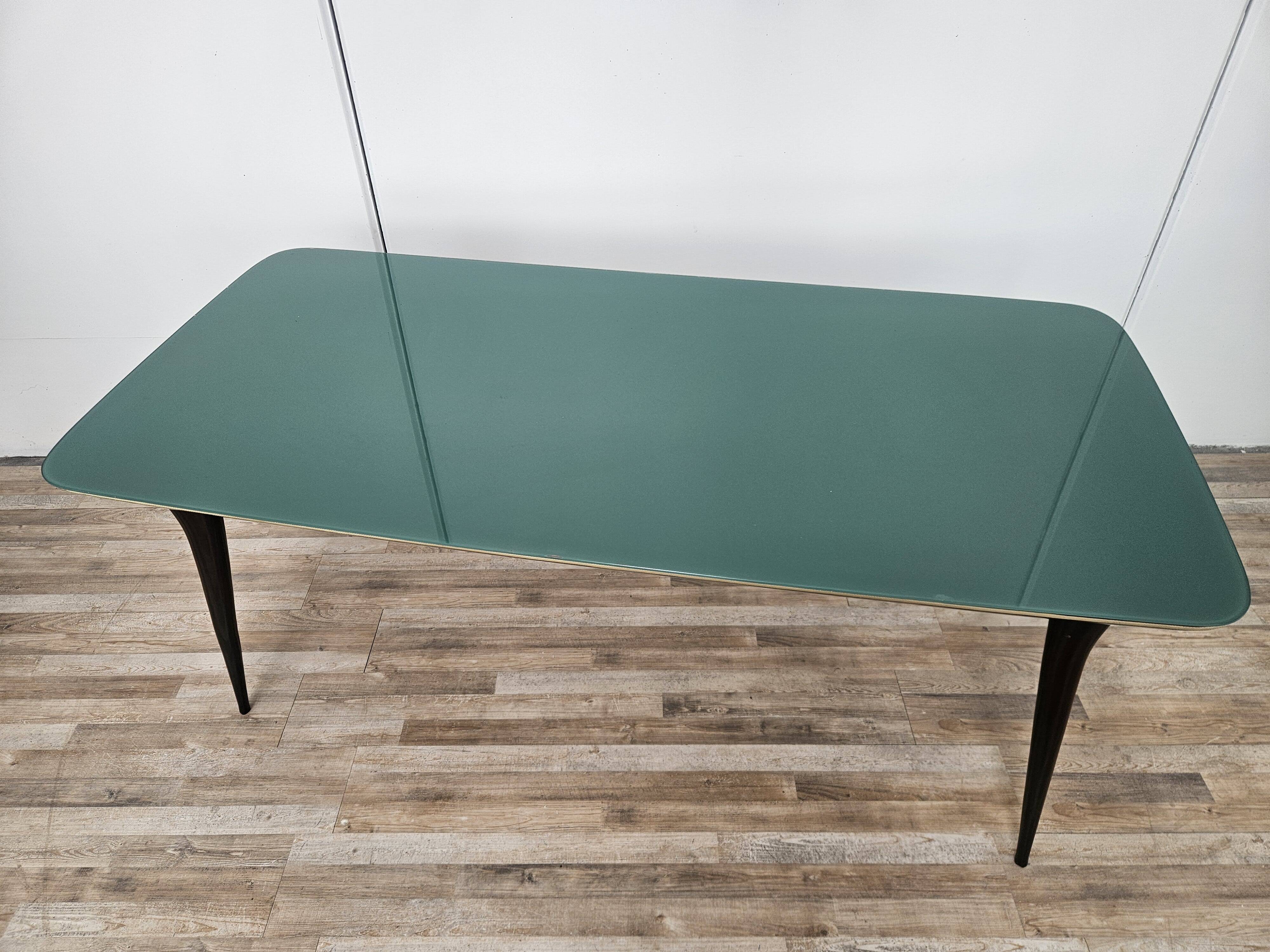 Mid-century mahogany dining table with aquamarine glass top