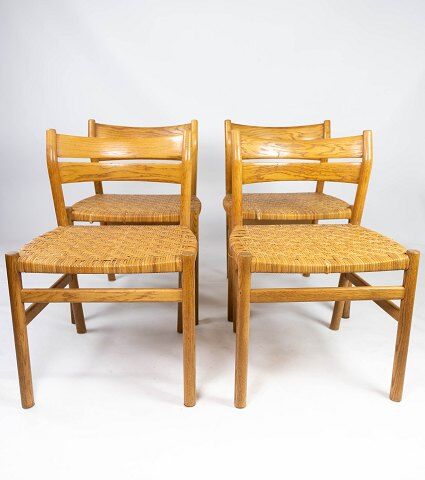 A set of four dining room chairs in oak and seat in papercord, designed by Børge Mogensen