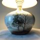 Glazed ceramic ball lamp signed Bossis with a fabric shade.
