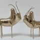 Two stylized zebu with long vintage brass horns