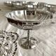 Vintage stainless steel cups on foot
