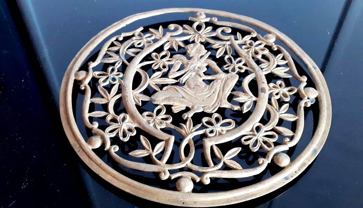 Old metal trivet