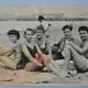 Old film photo circa 1950 the beach group of teenagers