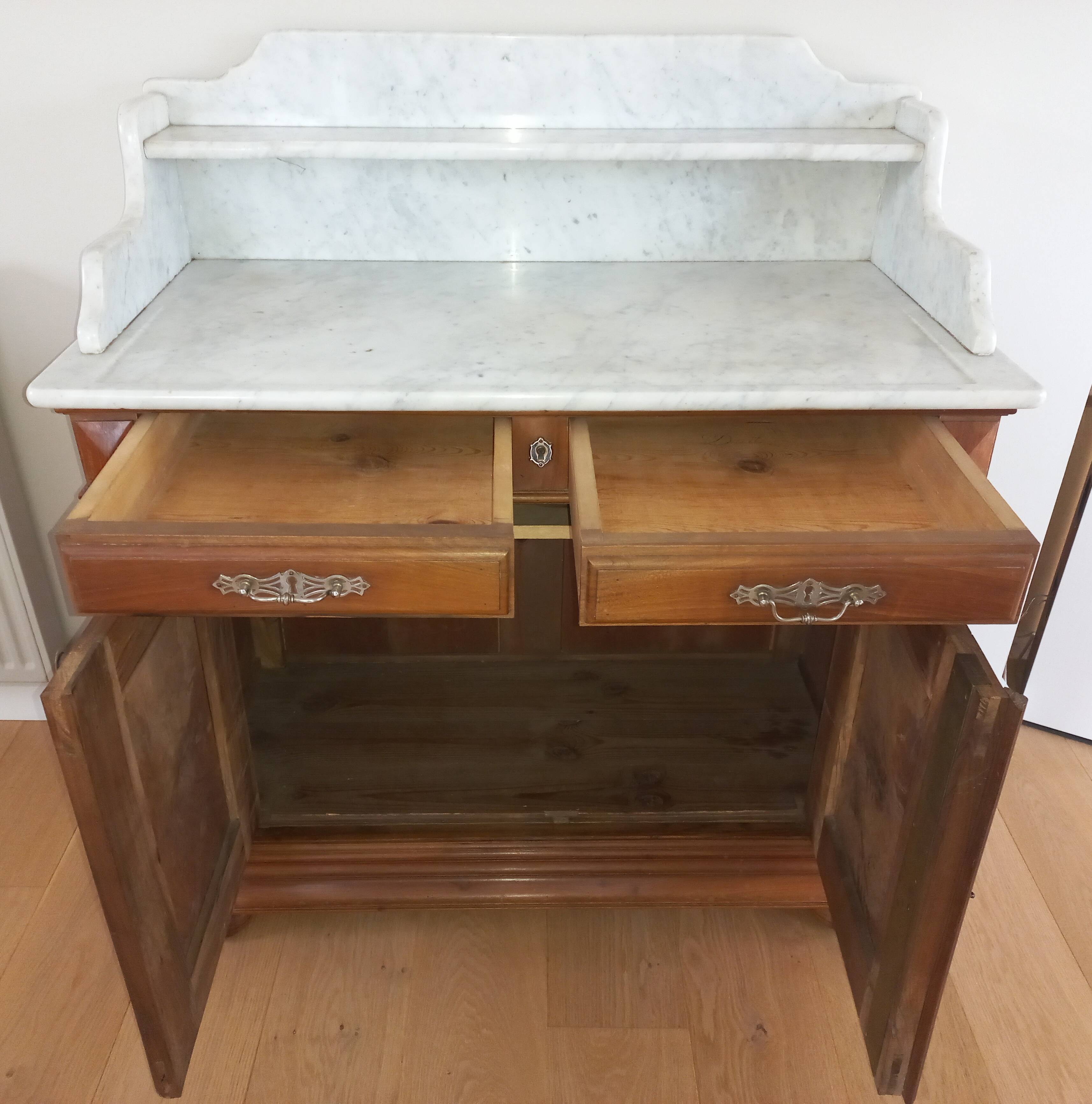 Empire period bathroom furniture in solid walnut and white marble.