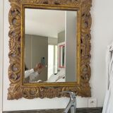 2 miroirs rectangulaires en bois sculptés, patine dorée