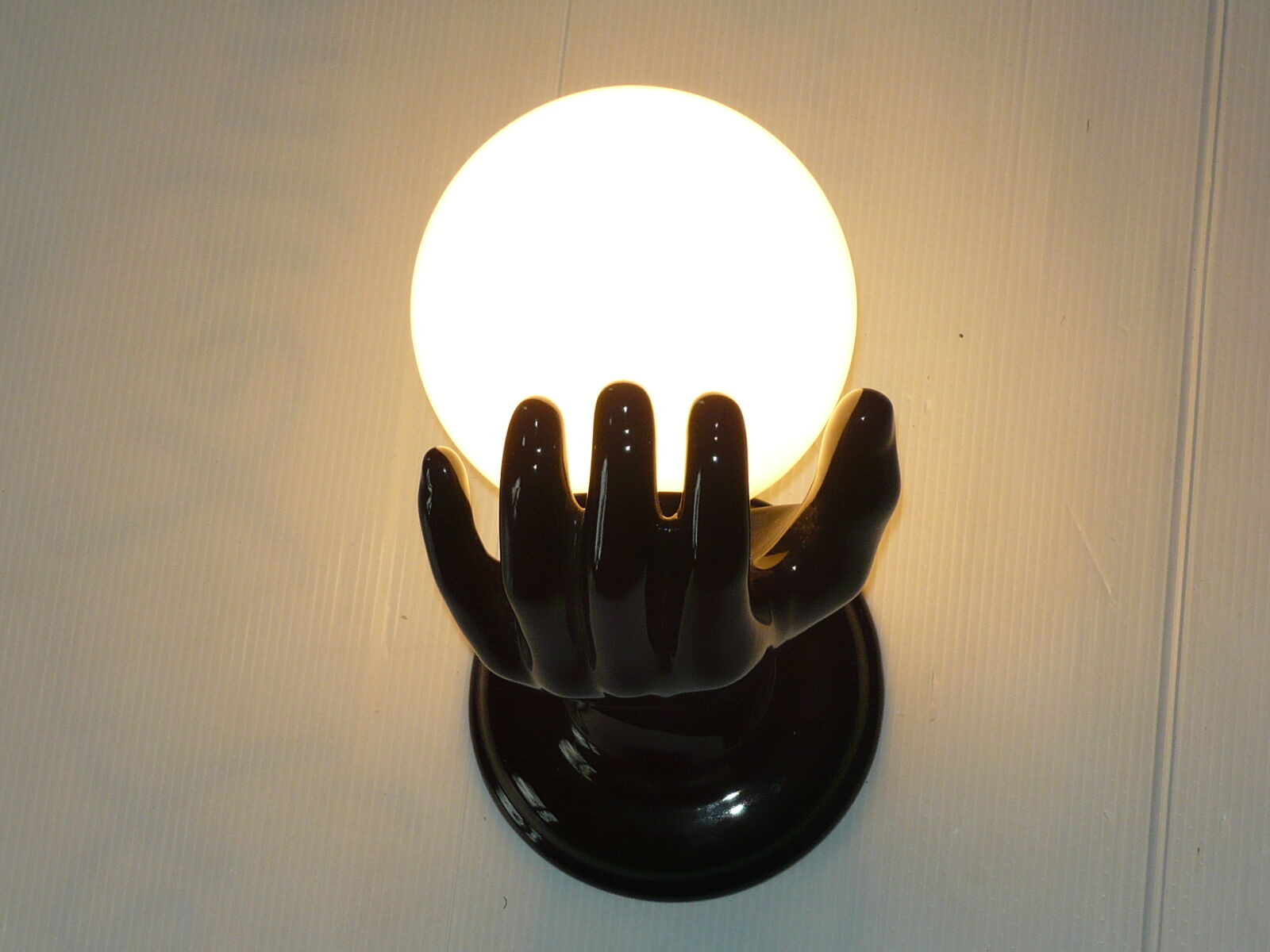 Ceramic hand wall lamp