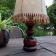 Rustic turned wood table lamp with vintage leather shade