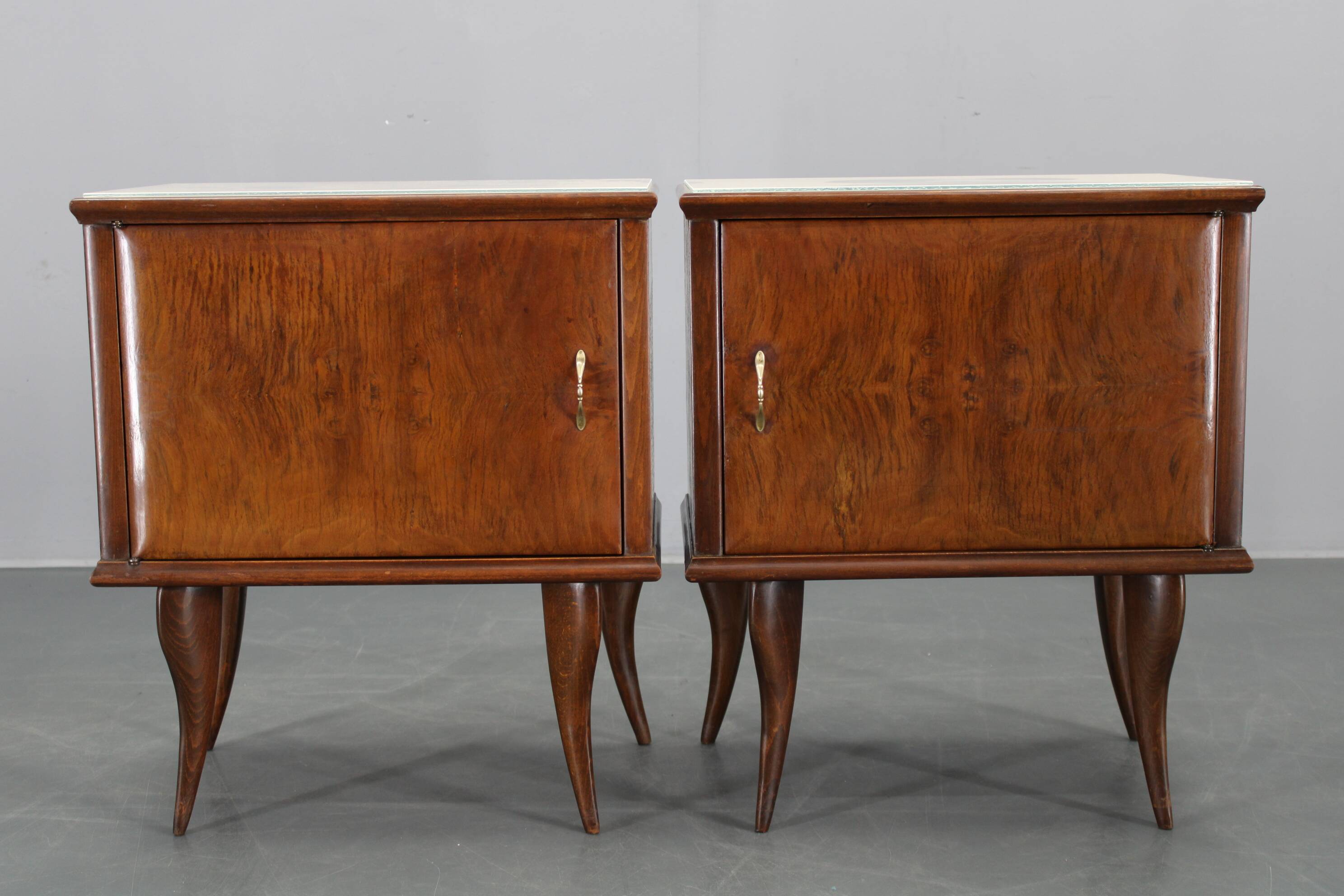 Pair of mid-century Italian walnut nightstands with glass top, 1950s