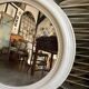 Oval mirror in pearl-coloured stucco 85 x 114 cm