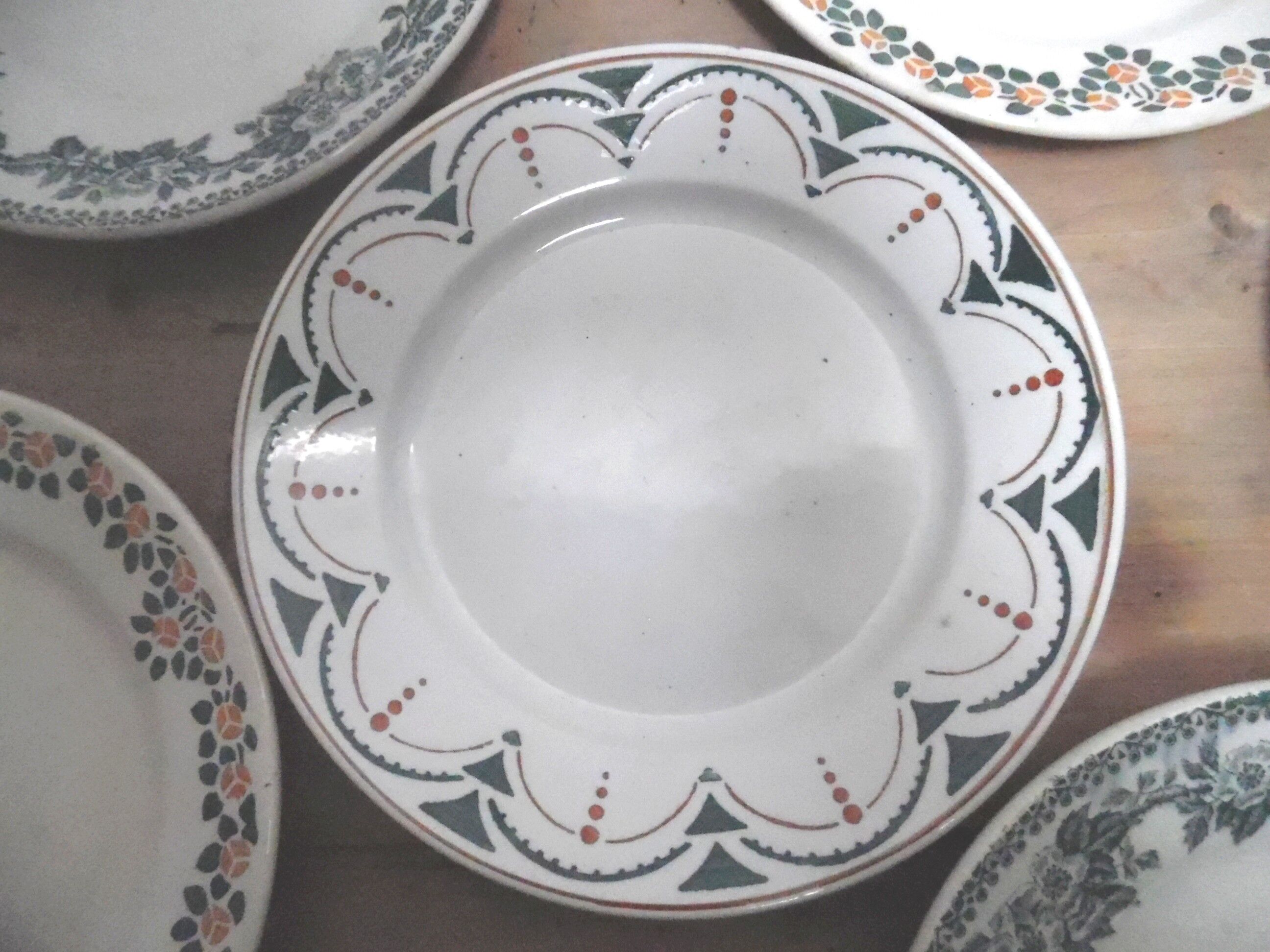 six plates mismatched earthenware