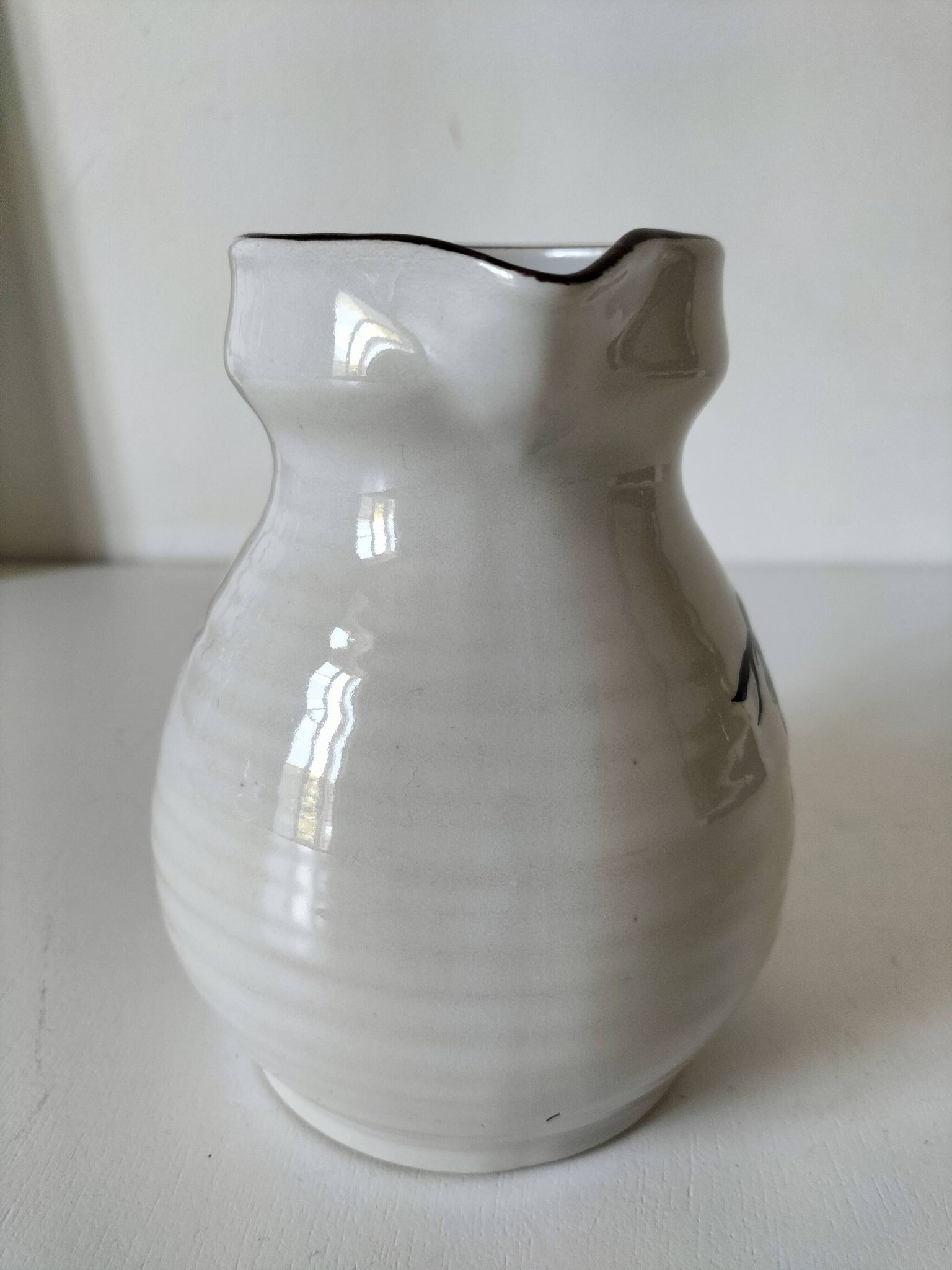 Ceramic pitcher from Quimper, created by Dominique Villard.