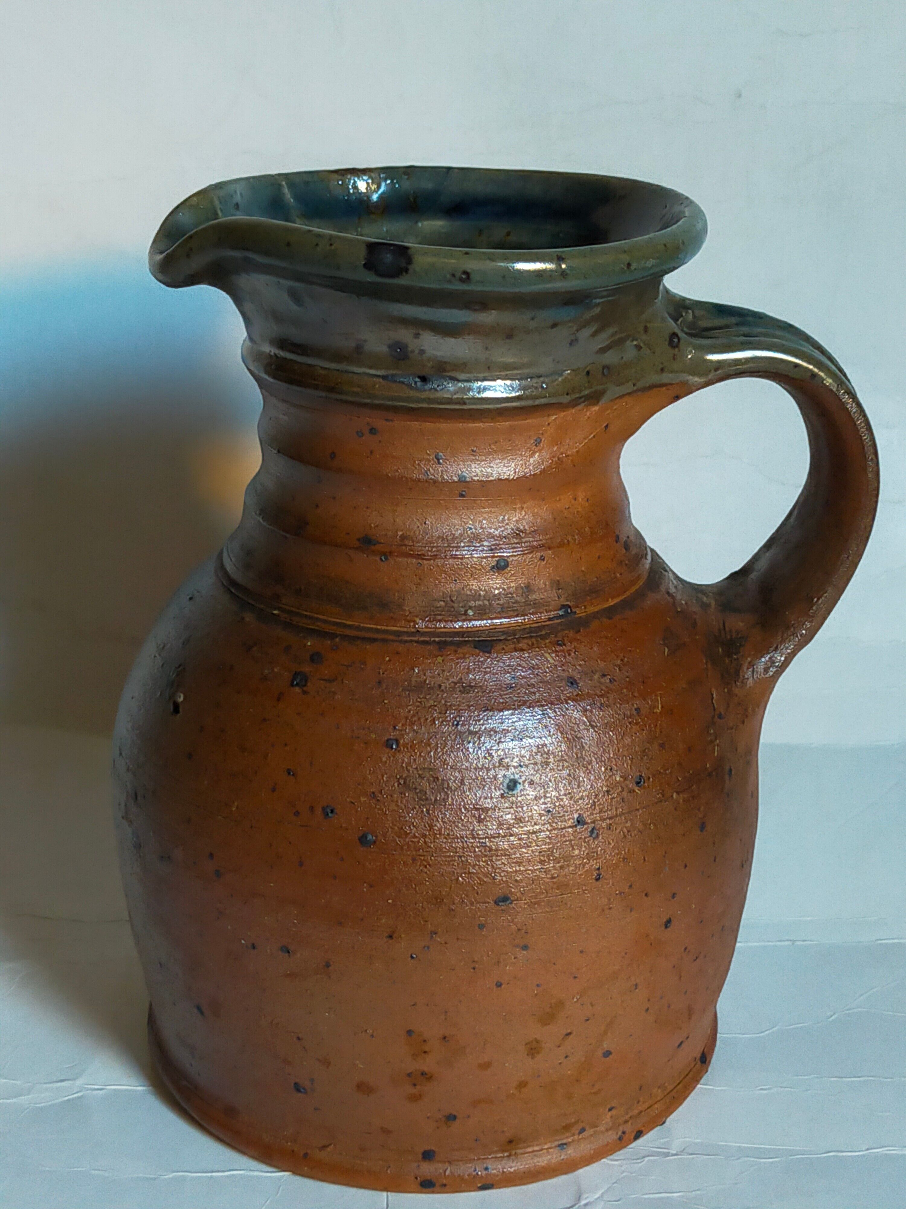 Pitcher traditional pottery Folk art in old enamelled sandstone