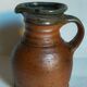 Pitcher traditional pottery Folk art in old enamelled sandstone