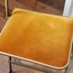 Two gold velvet folding chairs