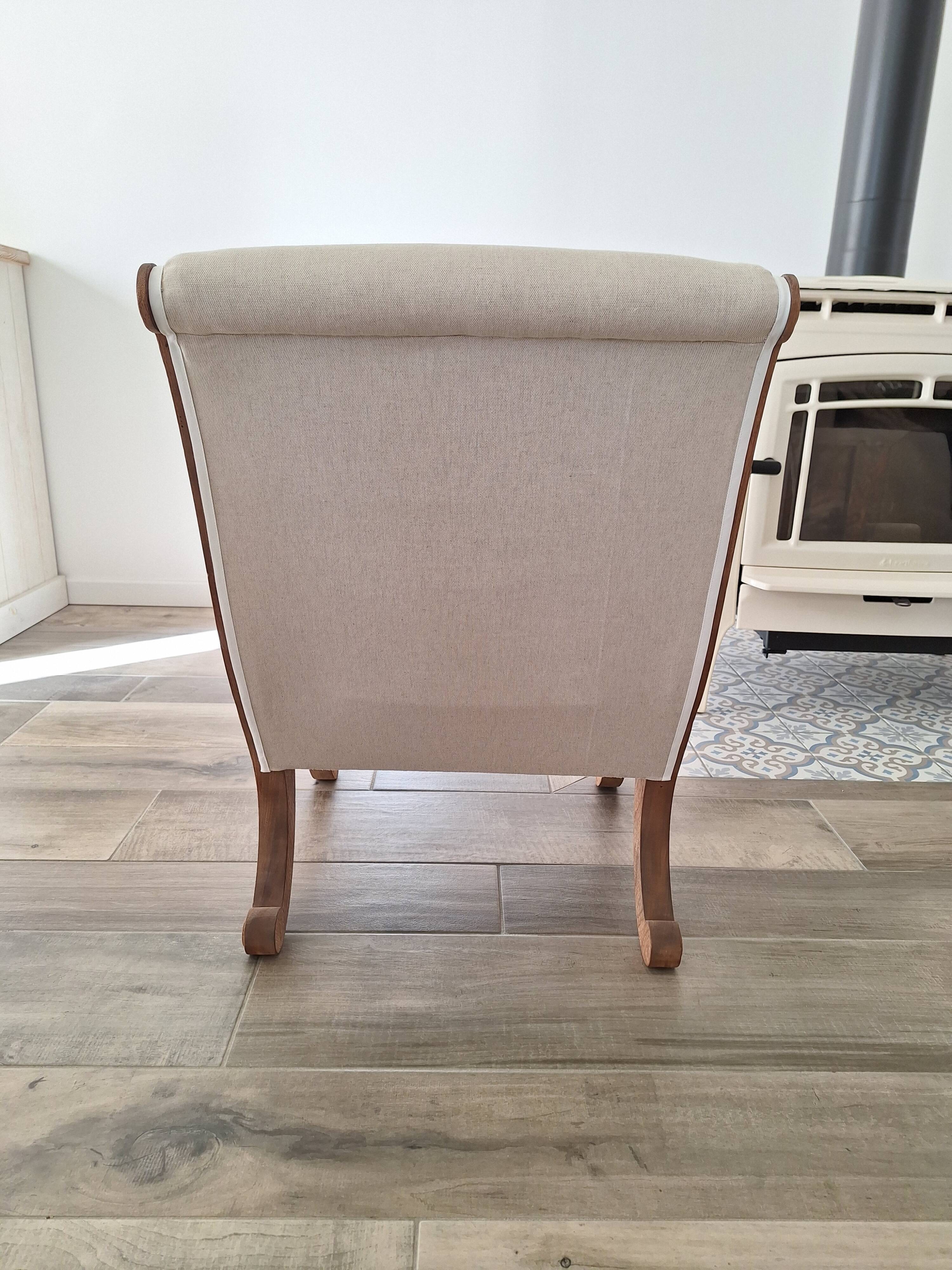 Vintage gondola armchair in beige linen fabric.