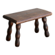Vintage rectangular stool in dark wood with turned legs.