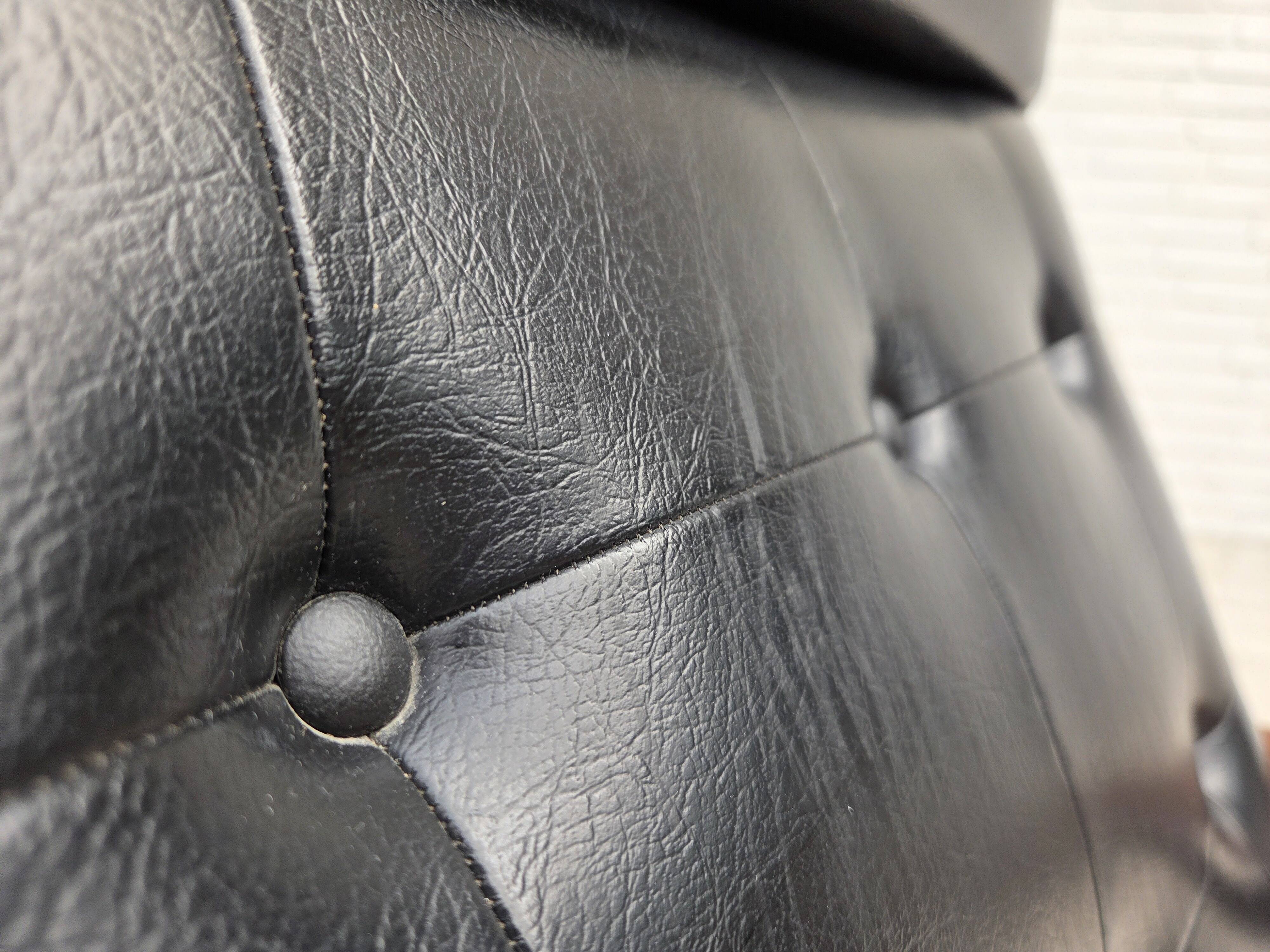 1970s, Danish armchair, black artificial leather, teak wood.