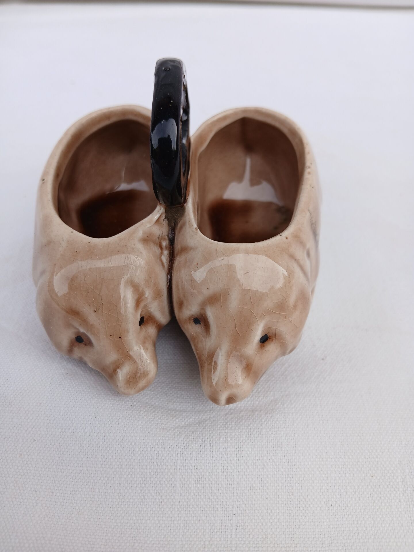 Old ceramic salt and pepper shaker in the shape of pigs.