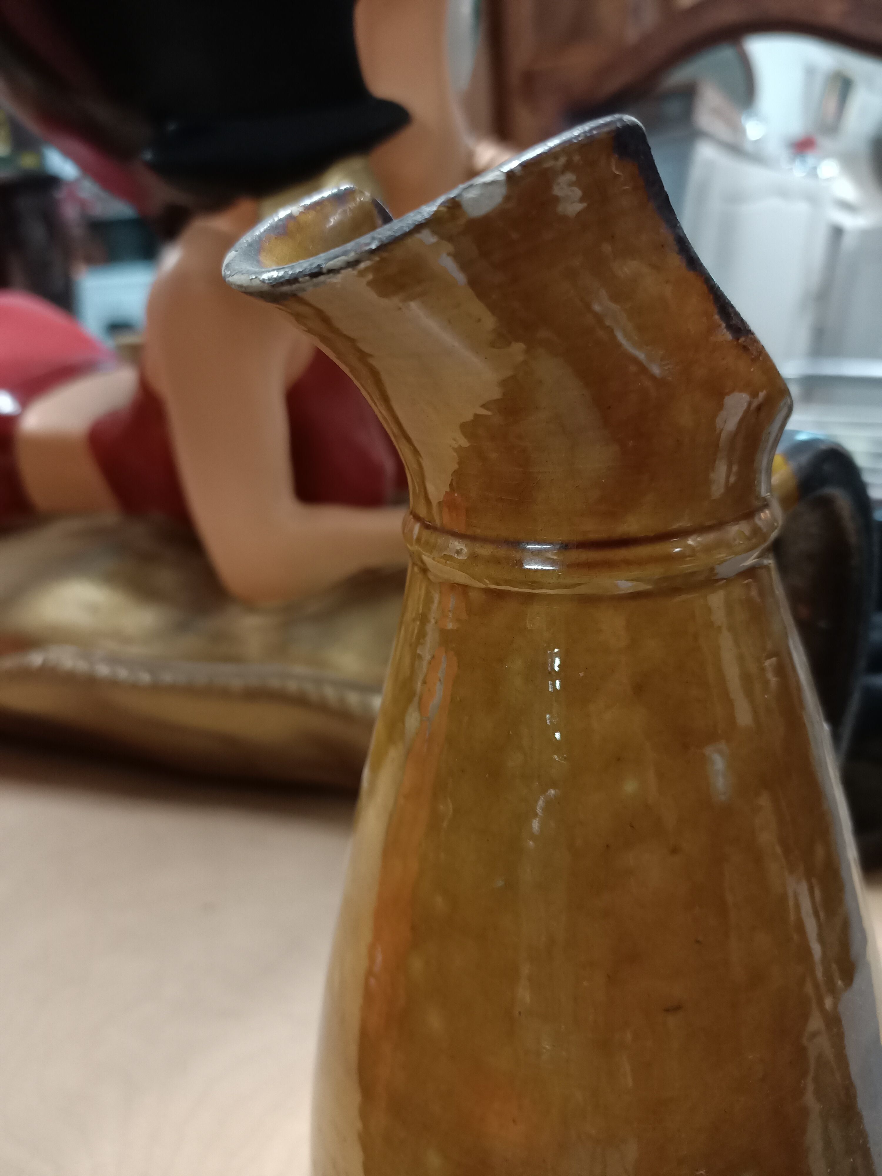 Enamelled terracotta jug