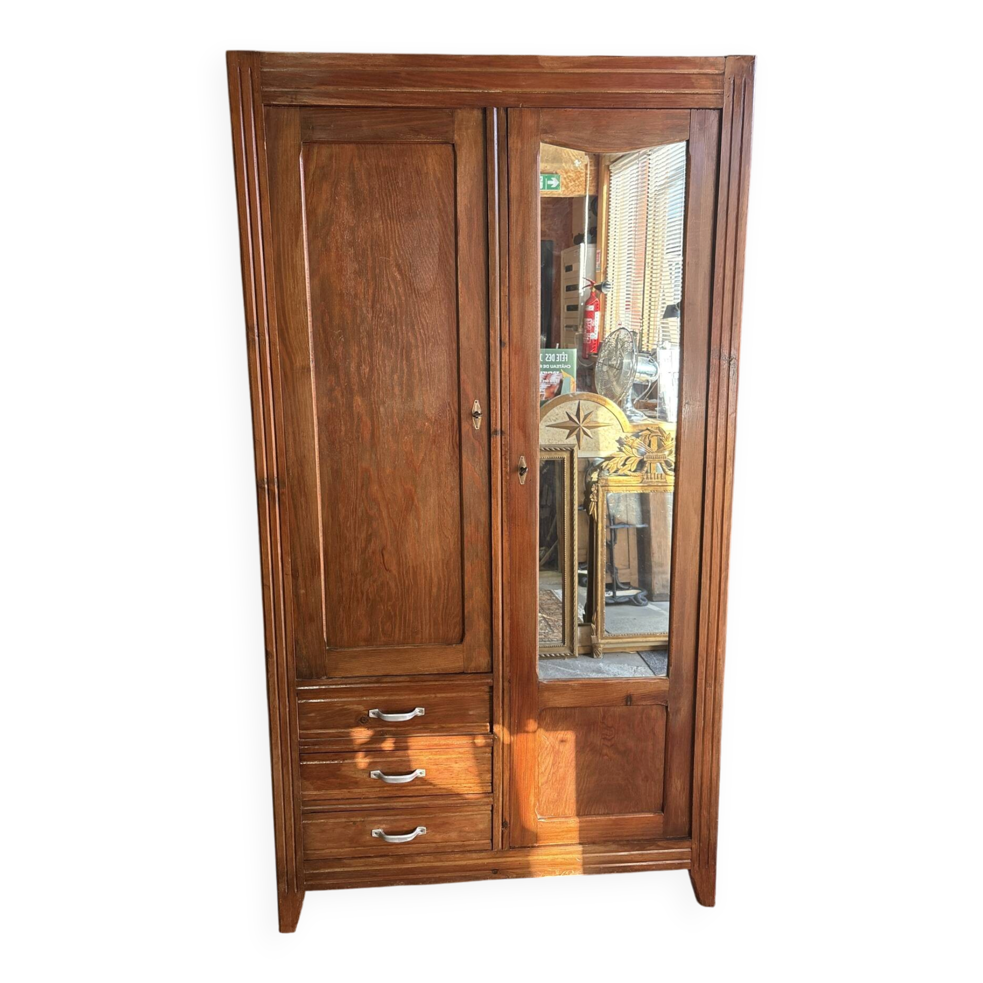 Antique Parisian wardrobe with mirror, hanging space and drawers.