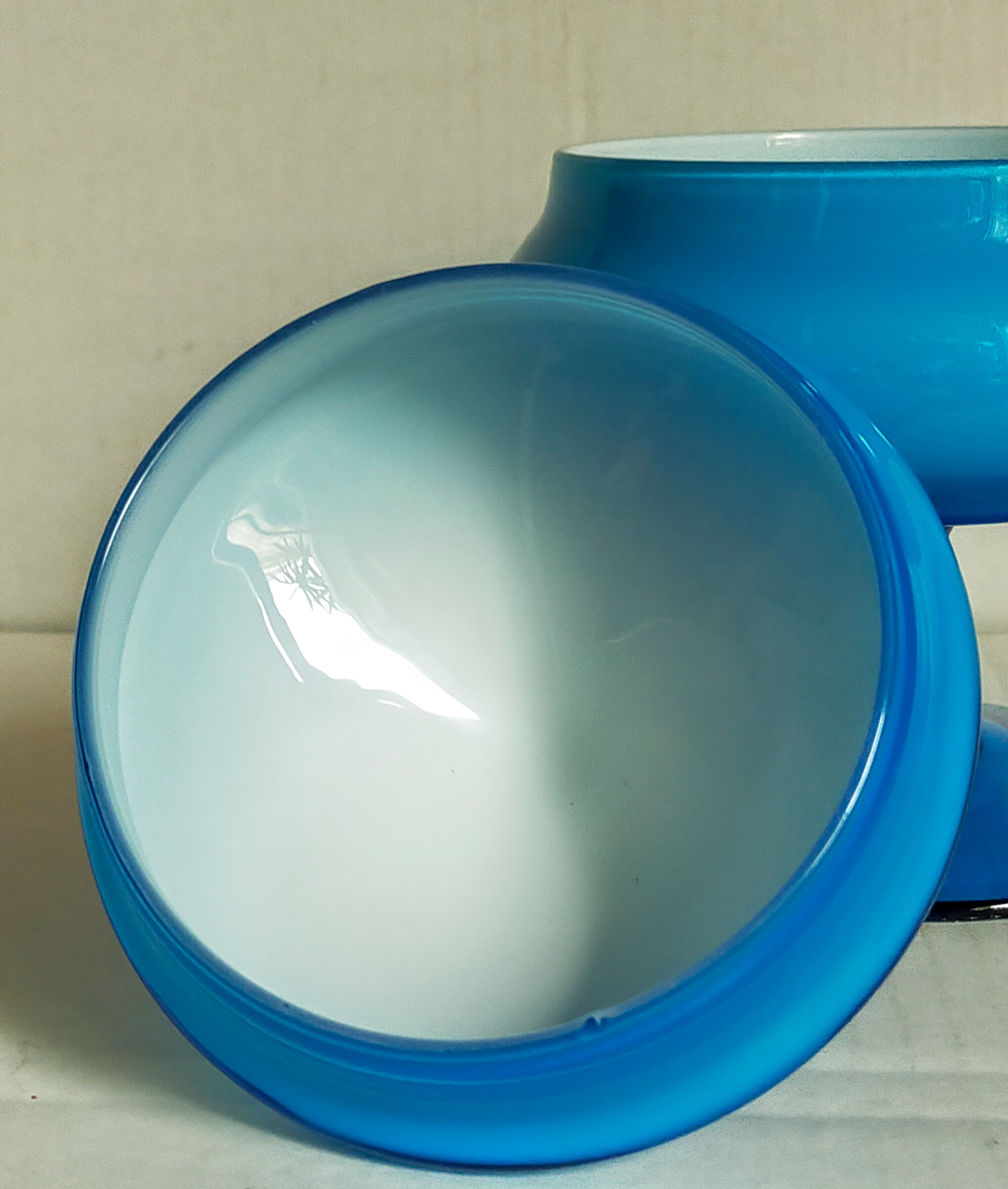 Covered pot on foot in vintage blue opaline