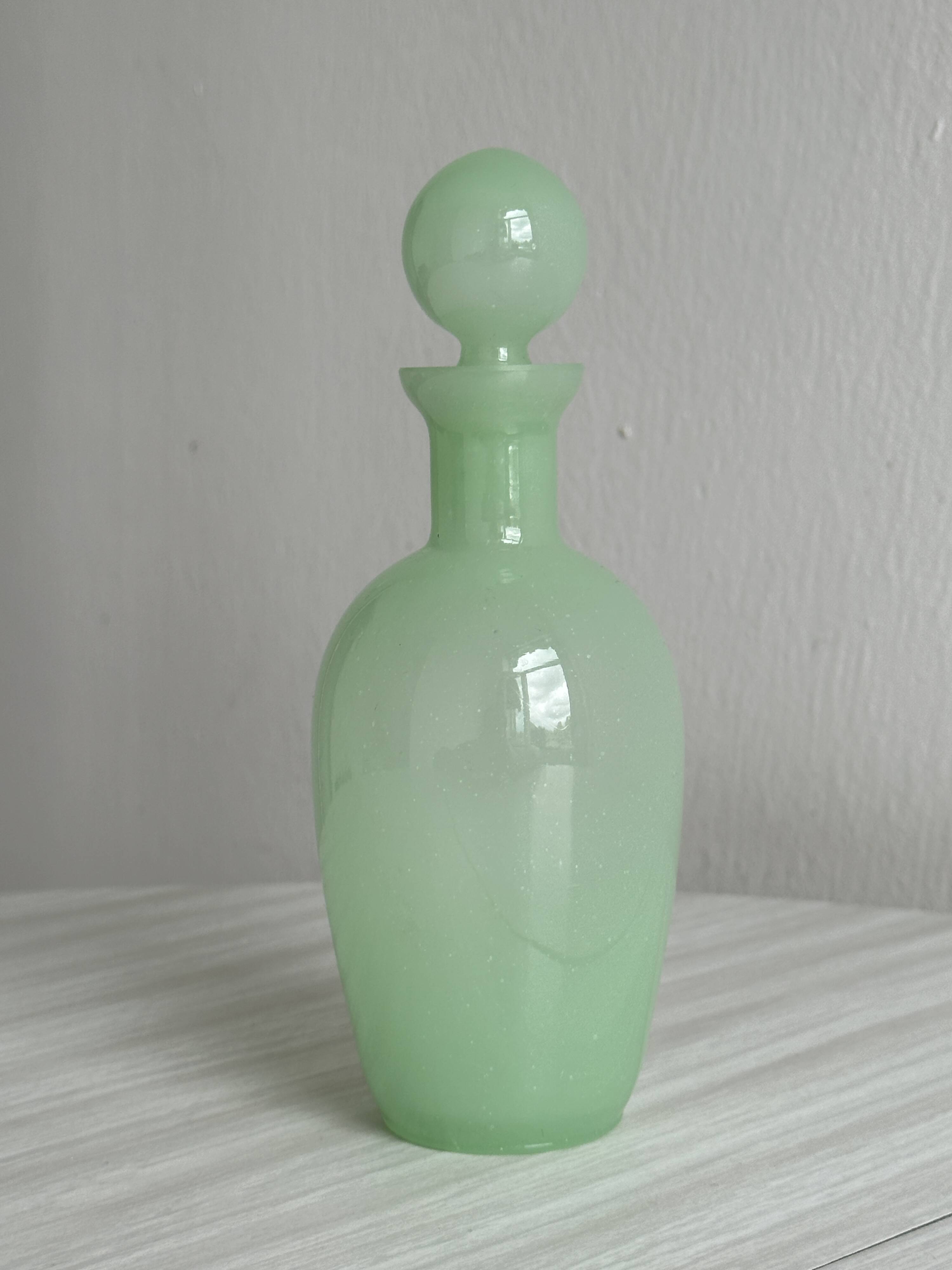 Opaque light green glass vial