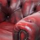Red English cowhide Chesterfield armchair finished with decorative nails