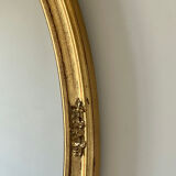 Oval mirror in carved wood