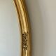 Oval mirror in carved wood