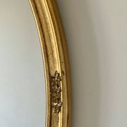 Oval mirror in carved wood