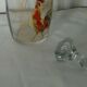 Glass carafe with enamel decoration featuring a rooster, late 19th century.