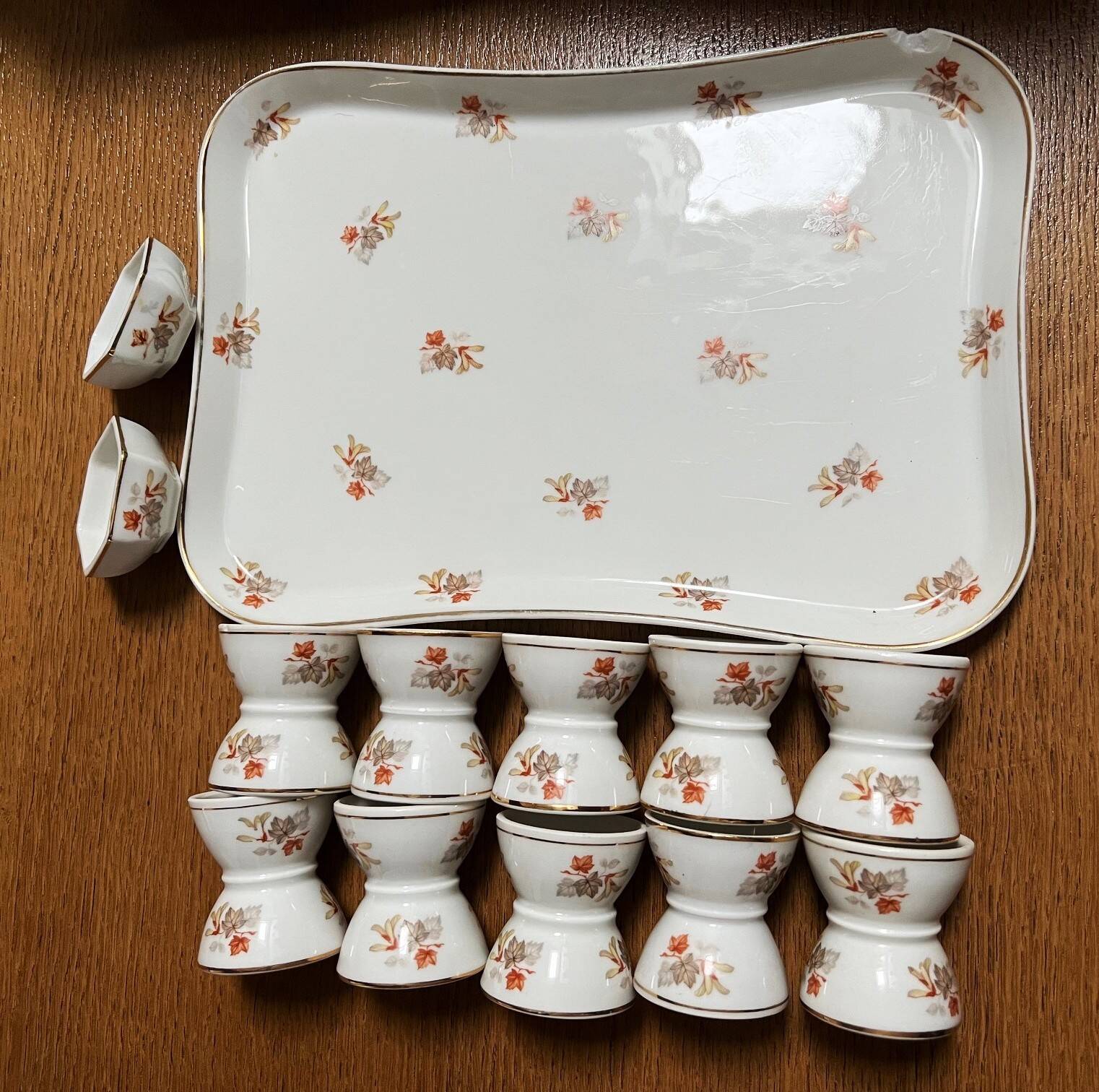 Service of 10 diabolo egg cups, 2 salt cellars and Haviland porcelain tray and