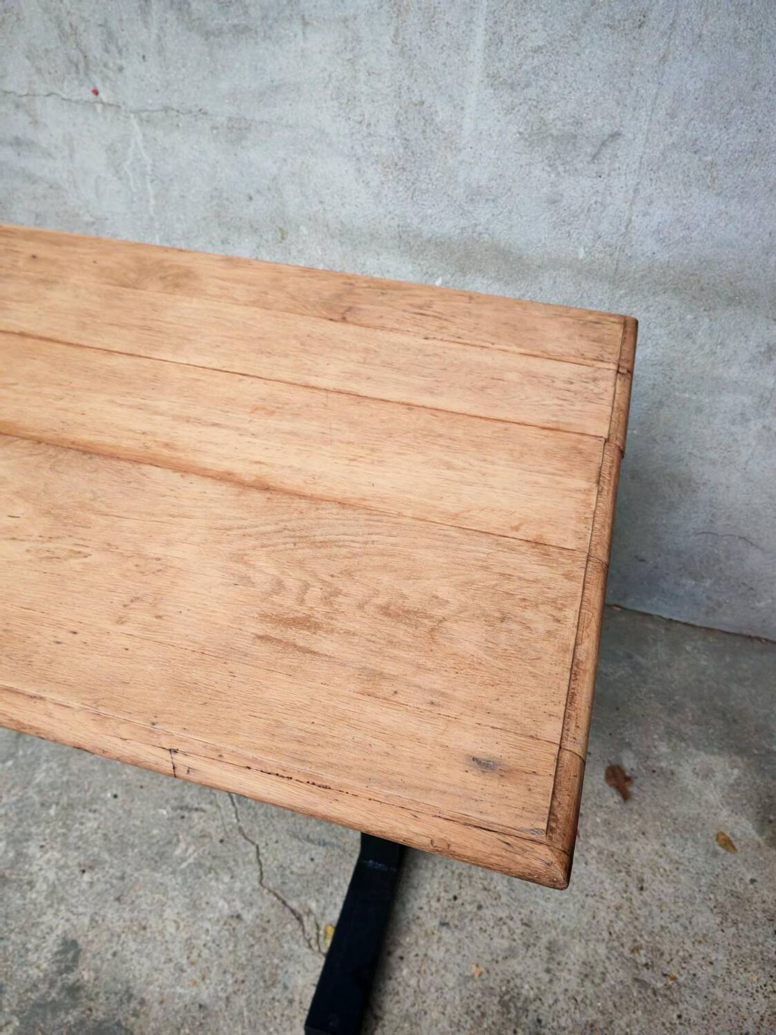 Unique wooden table with metal industrial legs.
