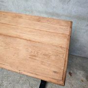 Unique wooden table with metal industrial legs.