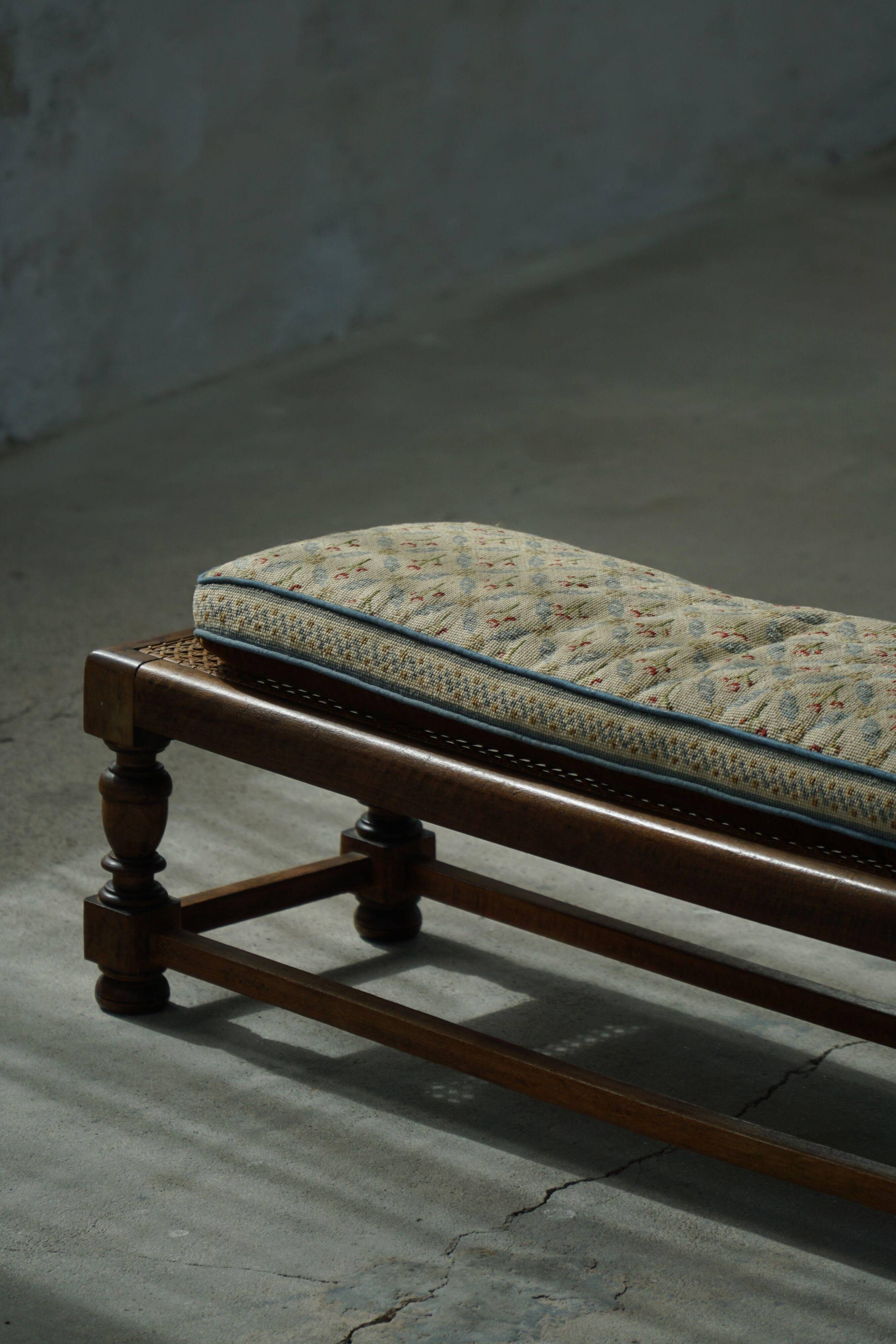 Danish oak footrest with hand-embroidered cushion and rattan seat, baroque, 1940s.