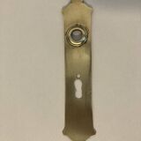 Door handle plate with brass keyhole