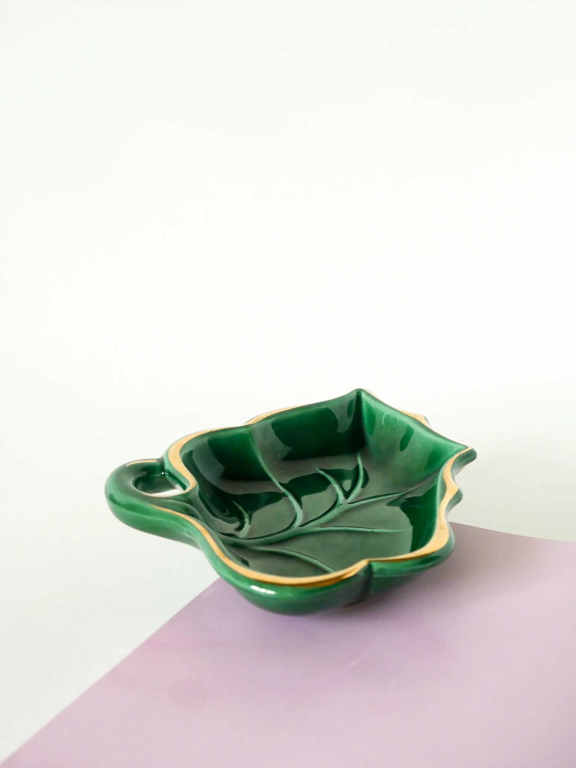 Leaf-shaped earthenware catchall, green and gold, 1970.