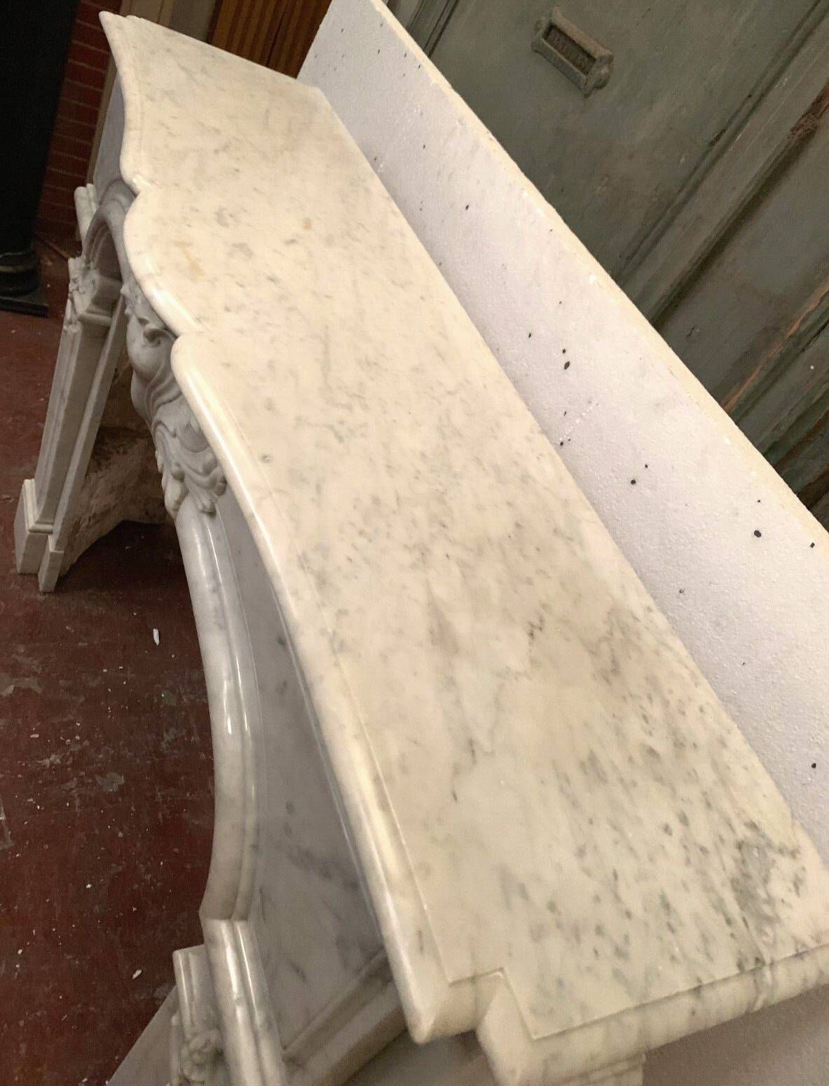 Regency style fireplace in white Carrara marble, Italy, 19th century.